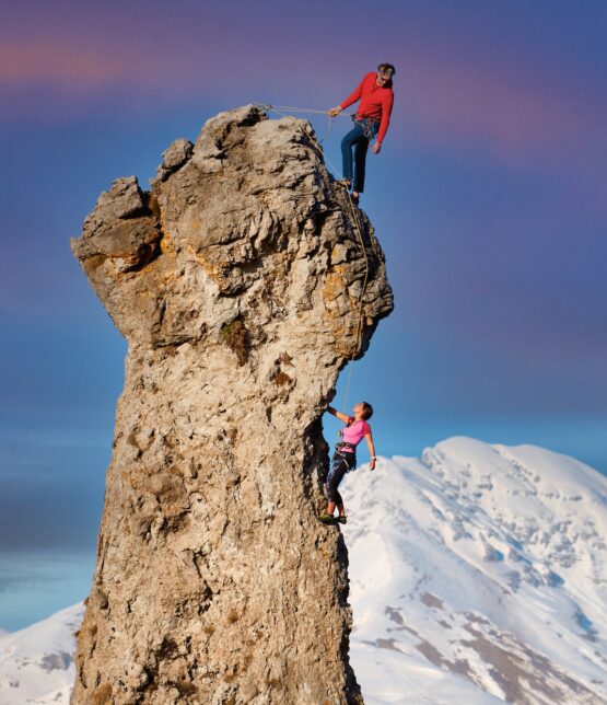 Male and female rock climbers